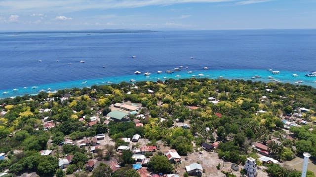 Coastal village with clear blue sea