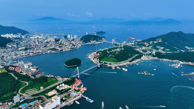 Coastal Cityscape with Bridge and Boats