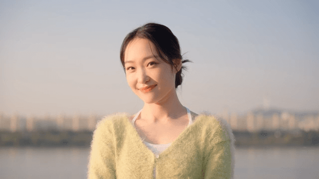 Woman smiling by the riverside