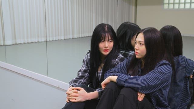 Young women resting in a dance studio