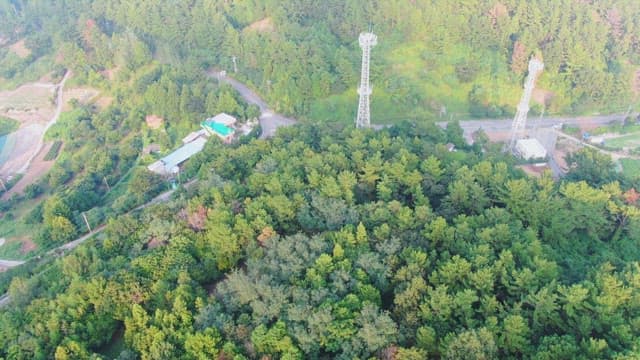 Dense forest with communication towers