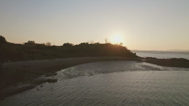 Serene beach at sunset with calm waves