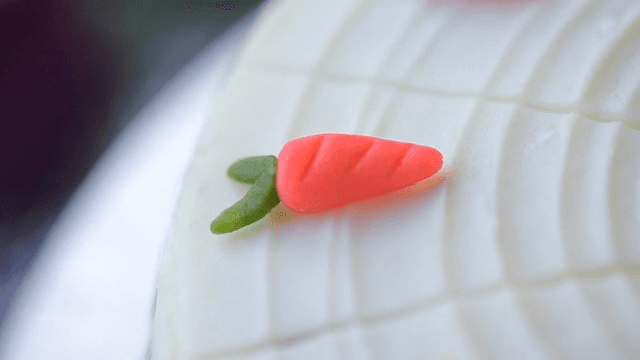 A cake with carrot decorations