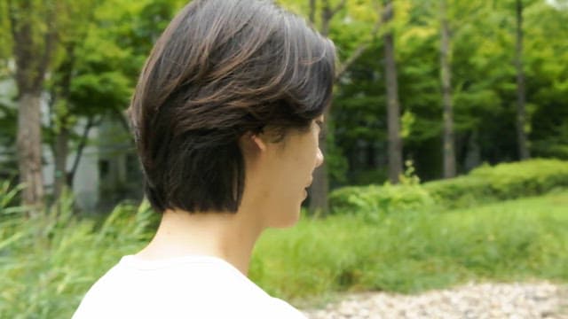 Man walking in a green park