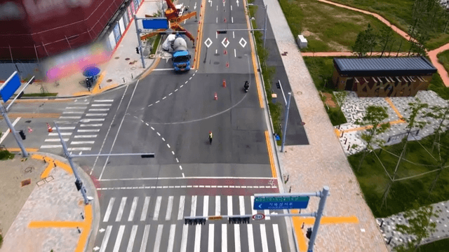 Motorcycle riding on a wide urban road