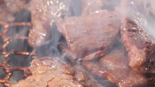 Sizzling beef on a grill