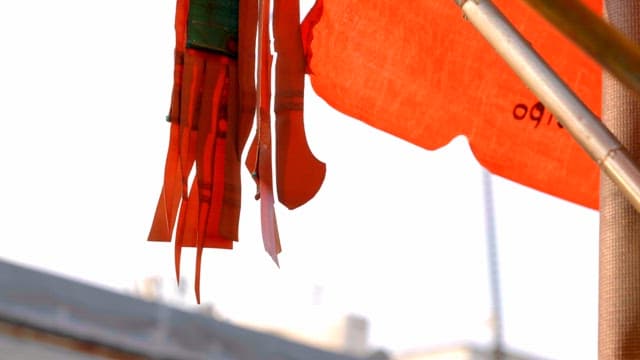Orange awning swaying in the wind