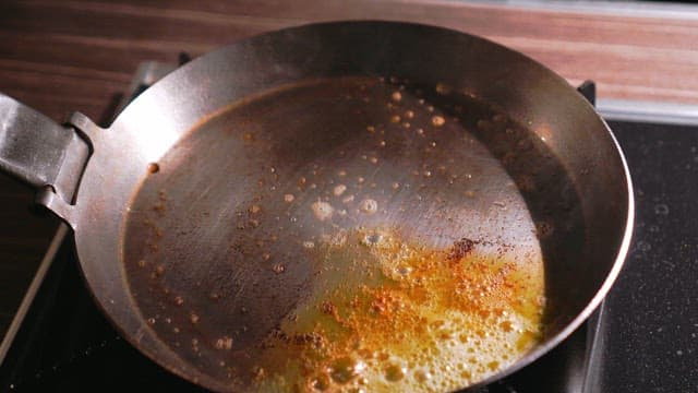 Stir-frying Vegetables and Abalone in a Pan