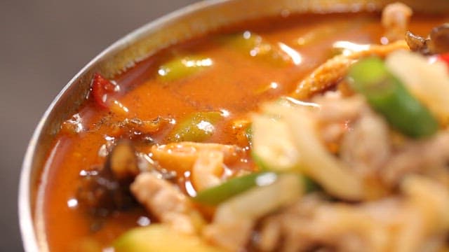 Spicy chili jjambbong with vegetables and meat