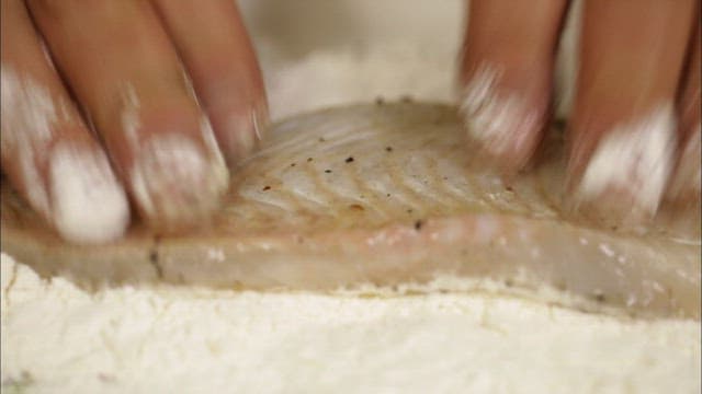 Grilled fish coated in flour