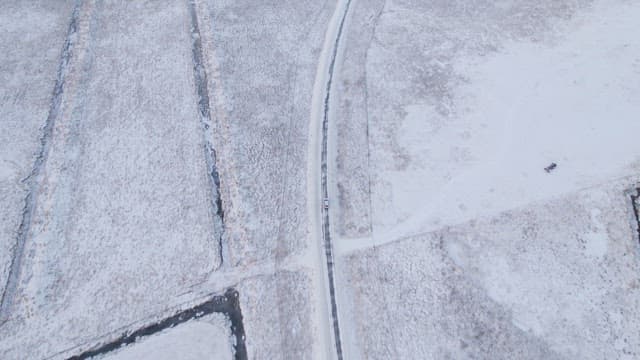Car driving on a snowy road