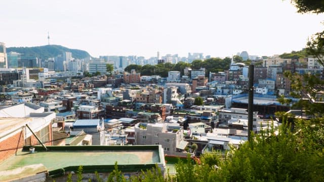 View of a densely packed urban area under a bright sky