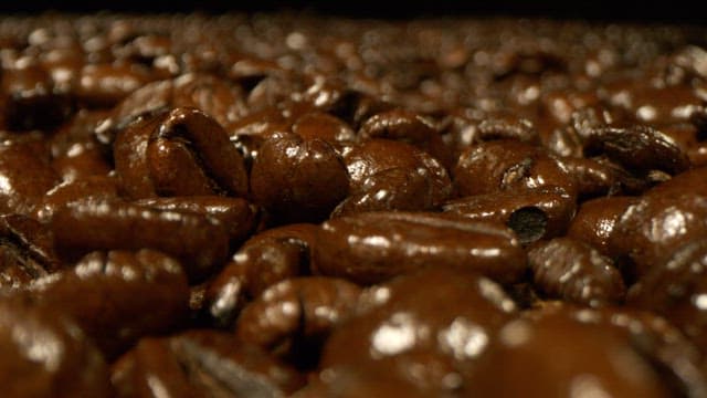 Roasted coffee beans falling from above