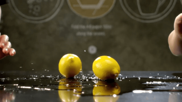 Lemons rolling over a shiny surface