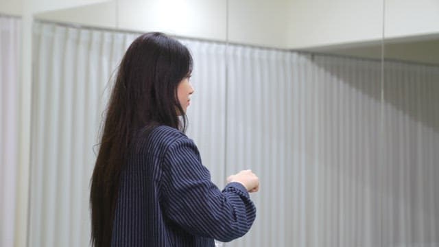 Woman drinking water indoors