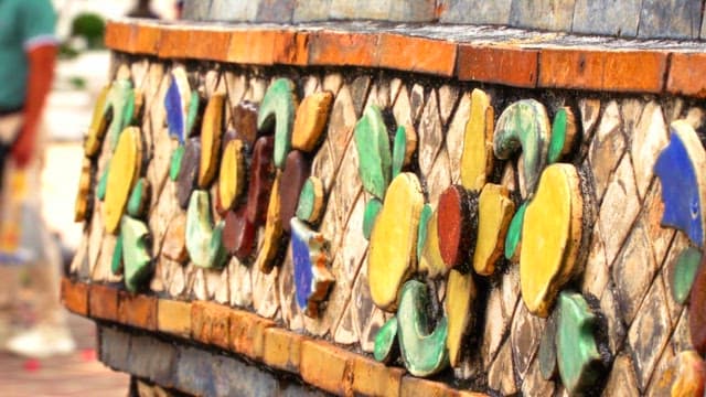 Ornate mosaic decoration of the architecture inside the Thai temple