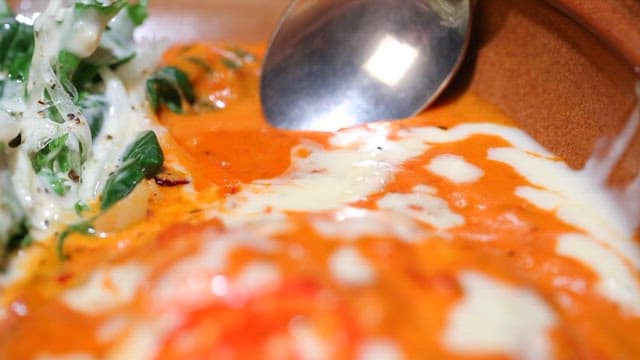 Creamy tomato soup with fresh greens