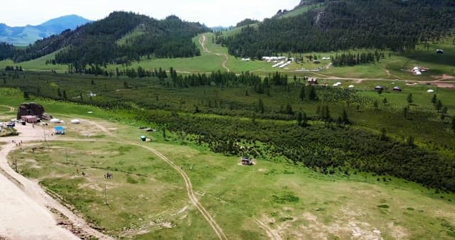 Expansive green landscape with mountains