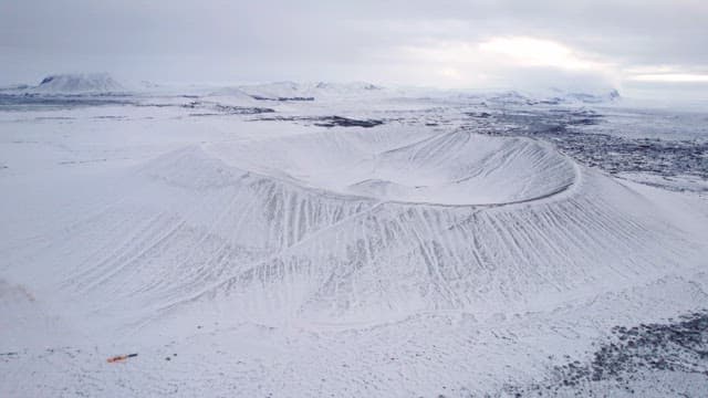 Snow-covered volcanic crater in winter