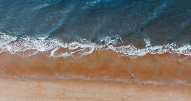 Waves Crashing on Sandy Shore
