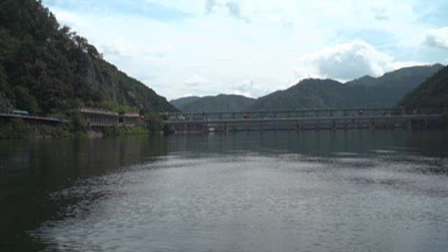 View of Serene Dam and Bridge in a Mountainous Region