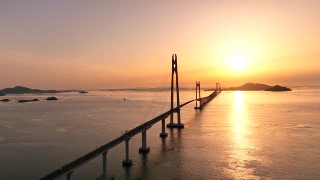 Bridge stretching over the sea at sunset