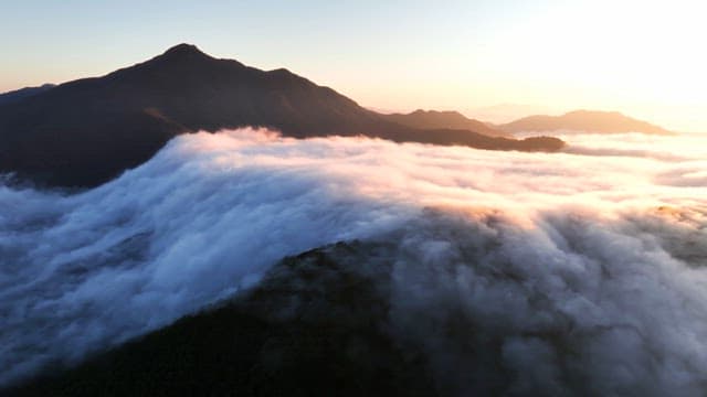 Mountains with clouds at sunrise