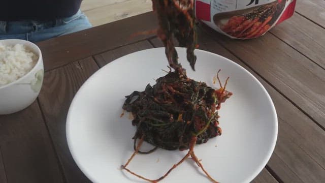 Plate of godeulppaegi kimchi is prepared on the table