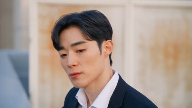 Man in a suit looking thoughtful