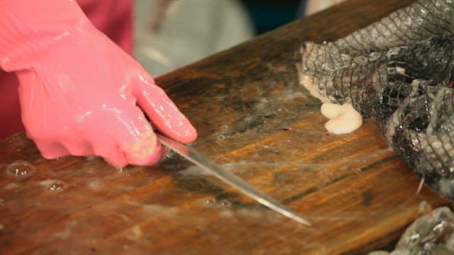 Preparing Seafood at a Fish Market
