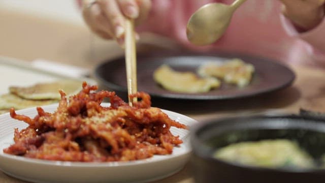 Spicy chicken feet eaten with chopsticks