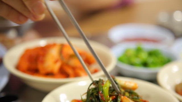 Green onion kimchi served with rice and grilled meat