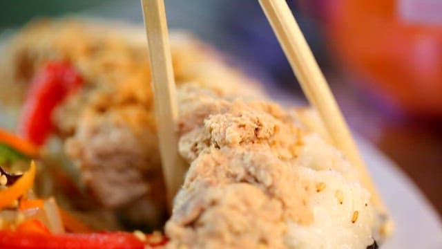 Nude kimbap picked up with chopsticks