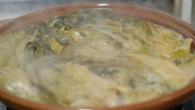 Korean style fermented kimchi stew boiling in a pot