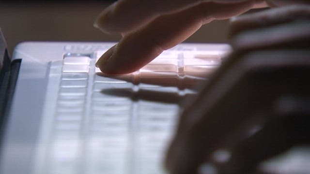 Fingers Typing on a Keyboard