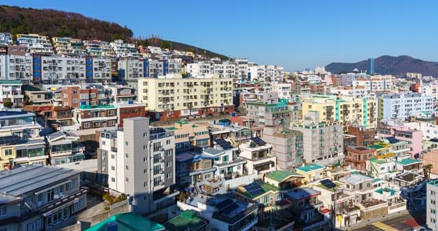Urban view with densely packed buildings under a cloudy sky