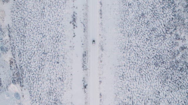 Car driving on a snowy road