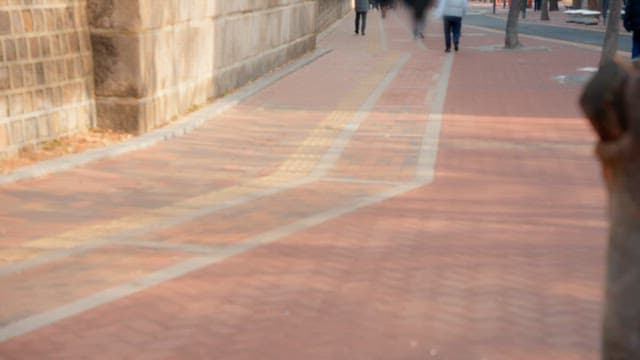 People walking on a sidewalk