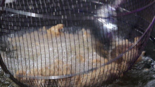 Frying pork in hot oil