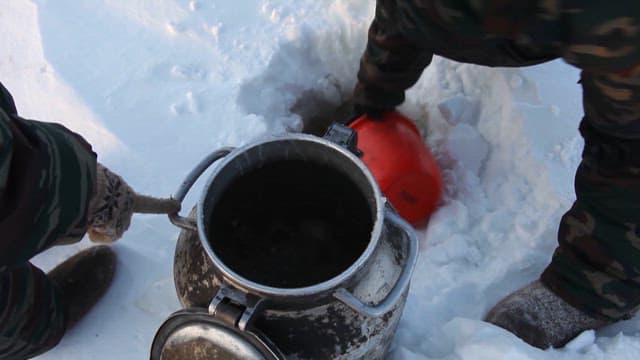 Drawing Water from a Hole in Ice