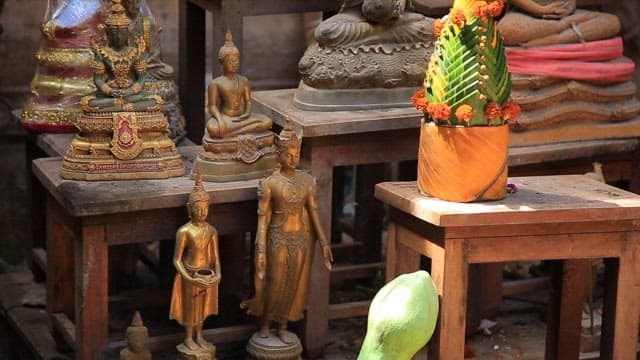 Buddha statues and offerings in a temple