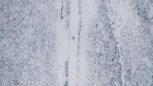 Car driving on a snowy road