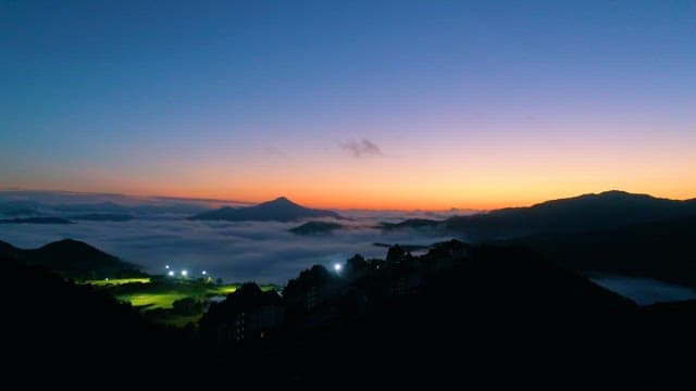 Dawn Coming over the Foggy Mountains with Golf Course