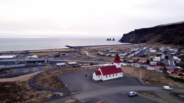 Coastal village with a red-roofed church