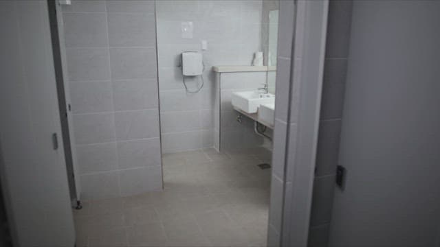 Woman entering a public restroom