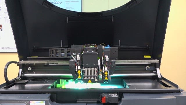 3D Printer in Operation Producing Objects