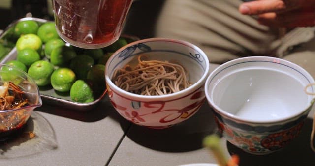 Preparing a traditional noodle dish