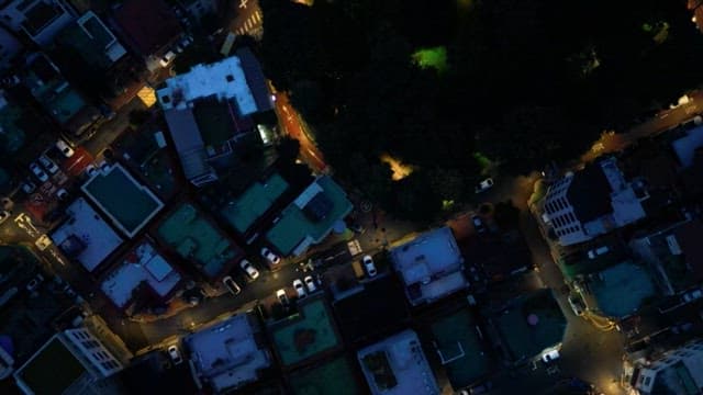 Aerial nighttime view of illuminated city streets