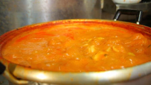 Spicy hand-pulled dough soup boiling in a pot
