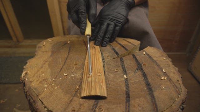 Wood carving with a chisel